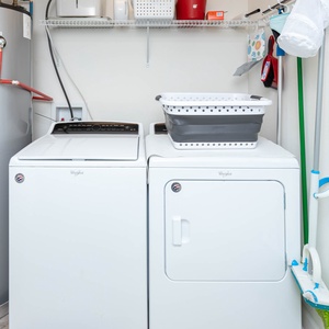 Enjoy the convenience of an in-unit laundry area with a washer, dryer, and ample storage for your essentials