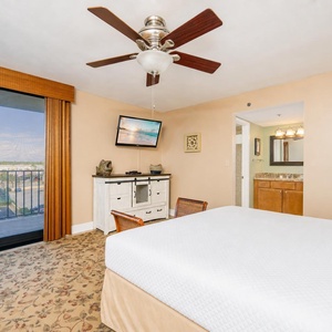 Quiet moments in the master suite with a gentle breeze from the balcony