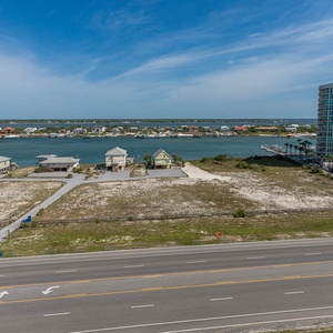 Enjoy views of charming homes and tranquil waters from your balcony, perfect for relaxation and unwinding