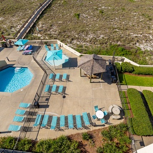 Cool water ripples invite calm moments poolside while the gazebo offers shaded relaxation