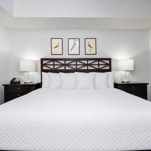 Drift into comfort in the king master suite, surrounded by serene decor and ready for restful nights on the beach