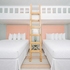 Enjoy a fun sleeping arrangement with two queen beds, a charming loft with two twin bunks, and playful decor