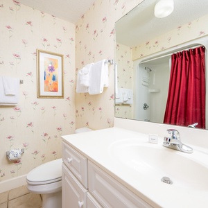 Freshen up in this guest bath in the relaxing shower or soothing tub before an exciting day