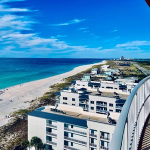 Panoramic views from your balcony with waves rippling along the beach below