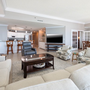 Relax on the cozy sofa with a queen sleeper in this inviting family room with breathtaking beachfront views