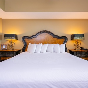 Unwind after a day at the beach in this elegant king master suite surrounded by stylish accents