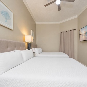 Drift into restful nights on plush queen beds, with calming decor inviting you to relax and recharge after beach fun