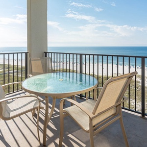 Balcony seating overlooks the beach and gulf, providing a serene spot to relax and enjoy the coastal view