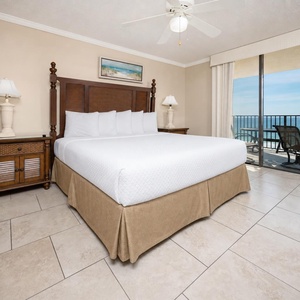 Slip into soft linens on the king master suite bed while hearing gentle waves from your balcony chairs