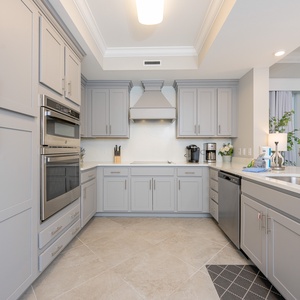 Upgrade your culinary experience in this stylish kitchen with modern stainless appliances and elegant design