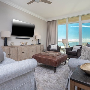 Relax in the cozy living area featuring a sofa with queen sleeper and enjoy streaming your favorite shows with beach views