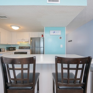 Relax on your cozy bar stools, taking in the vibrant coastal vibe while streaming your favorite shows