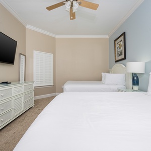 Unwind in this queen guest suite and stream your favorite shows or enjoy a good movie after a beach day
