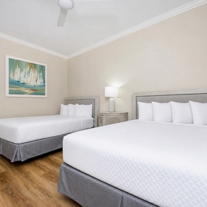 Unwind in two comfy queen beds in the guest room, surrounded by soft textures and serene decor, for restful nights