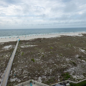 Stunning view of the beach with colorful umbrellas lining the shore, inviting relaxation and seaside enjoyment