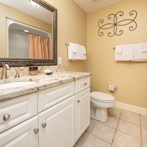 Enjoy a relaxing shower after a day of adventure in this guest bath with stylish accents and fluffy towels