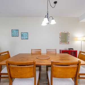 Gather around the dining table, enjoying the cheerful decor and sharing laughter as you create new memories