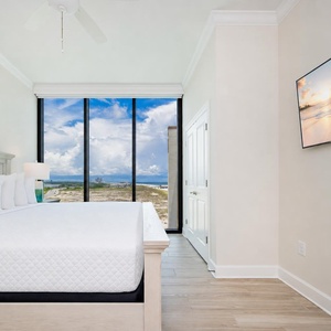Enjoy peaceful sleep in this guest bedroom featuring a king bed and TV for streaming your favorite show