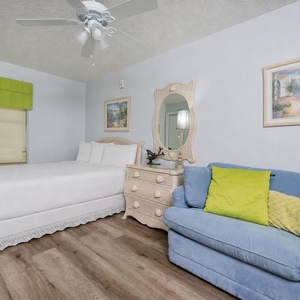 Sink into the plush sofa with a queen sleeper in this guest suite with a cozy queen bed