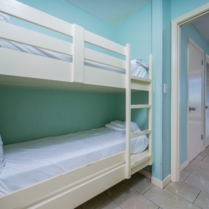 Enjoy this hallway space with two bunk beds for kids and access to the main living space