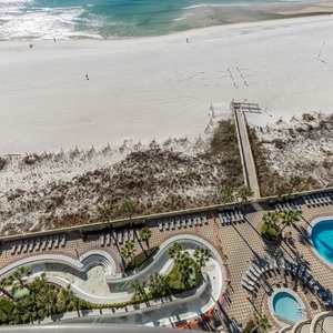 Discover the refreshing pool area with gradual entry, indoor hot tubs and pool, lazy river, and waterslide