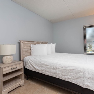 This bedroom features a comfortable bed and a window view, perfect for relaxing after a day of adventure