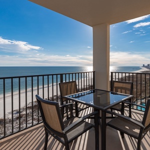 Balcony seating offers a serene view of the beach and tranquil gulf waters, perfect for relaxing or enjoying meals outdoors