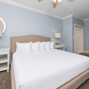 Retreat to the king master suite with cozy bedding and drift off to coastal sights and sounds of the bay