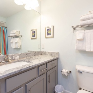 Freshen up in this guest bath in the relaxing shower or soothing tub before an exciting beach day