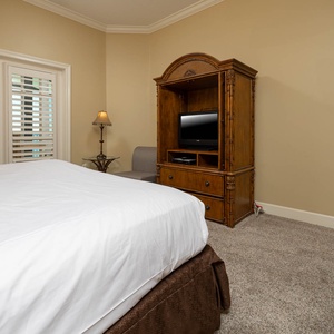 Unwind in the king master suite, enjoying your favorite shows from the plush seating under soft lighting