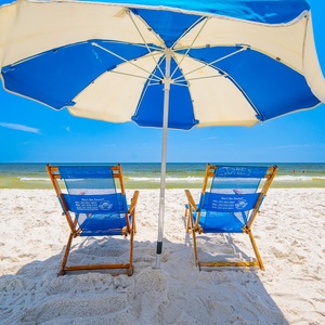 Stroll along the sandy beach with lounge chairs waiting for you and take in the beautiful coastal views from your rental