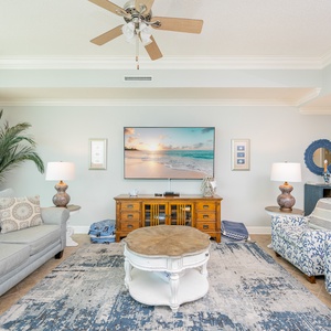 Unwind on the plush furniture, enjoying a movie night together while feeling the inviting beach vibe surround you