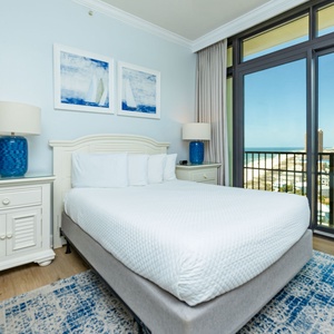 Escape to your serene guest suite, where the plush queen bedding invites restful nights with coastal sounds