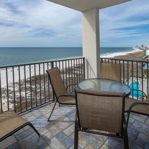 Balcony seating offers a serene view of the beach and endless gulf, perfect for enjoying the stunning evening sunsets