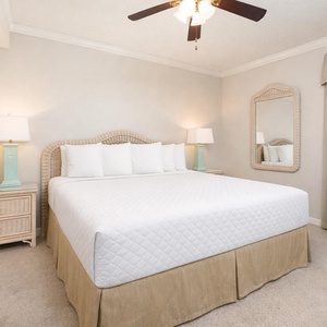 Drift into restful nights in the king suite, embraced by soft linens and surrounded by cozy, beach decor