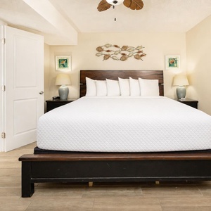 The cozy king suite welcomes you to rest deeply after a fun day at the beach