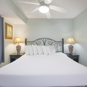The master bedroom features a plush bed and soft lighting, creating a serene retreat for restful nights