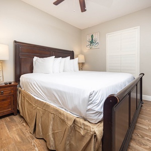 Rest in a comfortable guest bedroom featuring a king bed, stylish decor, and a flat-screen TV for your entertainment