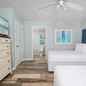 Guest suite with two doubles offers restful sleep and coastal art to soothe your vacation spirit