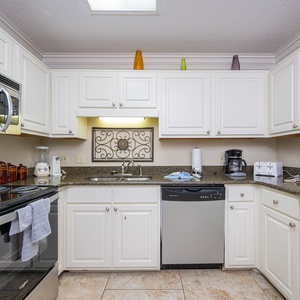 Prepare your favorite meals in this bright kitchen, featuring stainless appliances and ample counter space