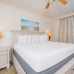 Retreat to the king master suite with cozy bedding and wake from a restful sleep