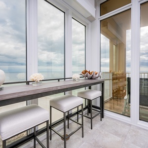 Enjoy leisurely conversations at the chic bar, while basking in panoramic views of the tranquil coast