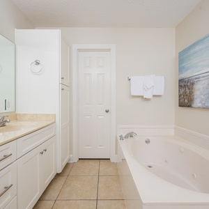 Indulge in relaxation in the master bath with a refreshing walk-in shower and soothing jetted tub