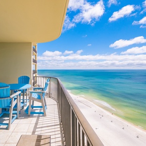 Savor the moment on your balcony, where vibrant views inspire relaxation and peace as you unwind in coastal beauty