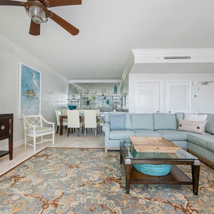 Gather in the spacious living room, enjoying laughter and good conversation in a welcoming atmosphere