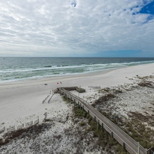 Enjoy the serene beach view with gentle waves and soft sand, perfect for relaxing strolls along the shore