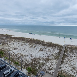 Stunning views of the pristine beach and gentle waves from this inviting coastal retreat