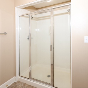 Indulge in relaxation in the master bath with a refreshing walk-in shower and soothing jetted tub