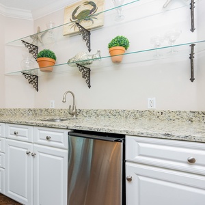 Grab a chilled drink from the fridge or create your favorite cocktail at the wet bar