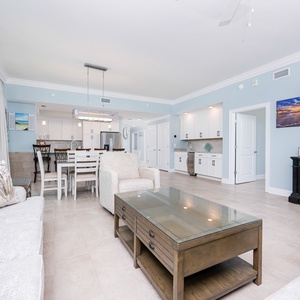 Relax in the spacious living area with comfortable seating, a large TV, and a dining space perfect for meals together